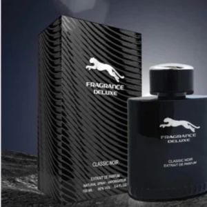 a black bottle next to a box Deluxe Perfume, luxury perfume UAE